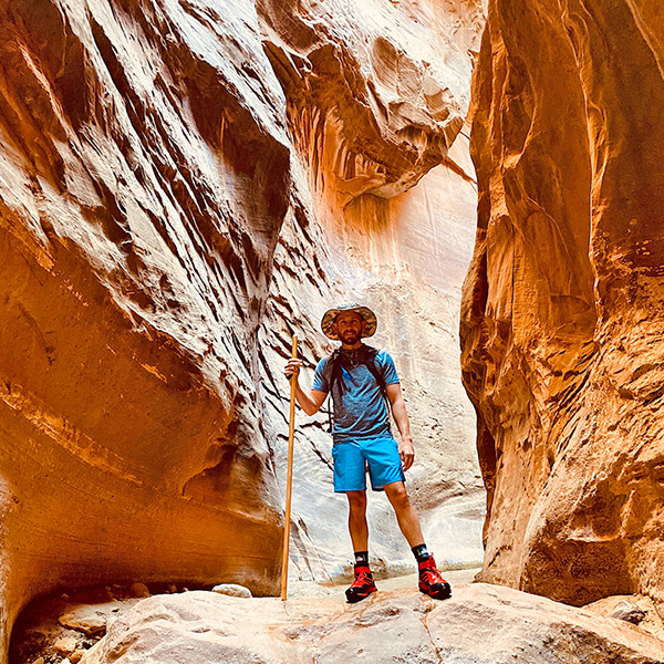 Man standing atop a mountain